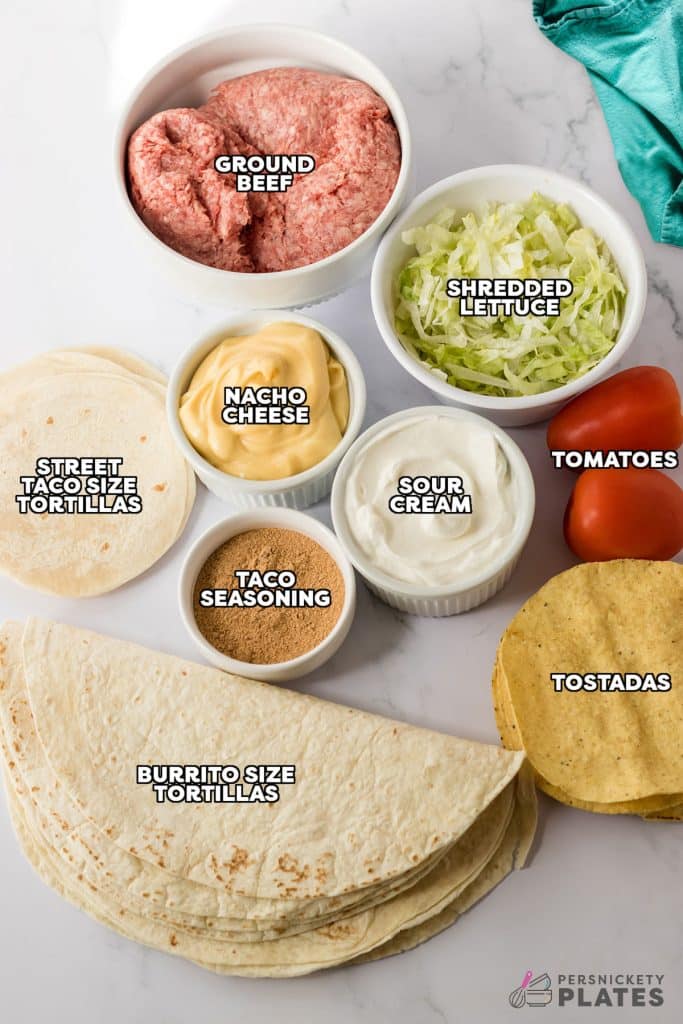 overhead shot of labeled ingredients to make a crunchwrap supreme.
