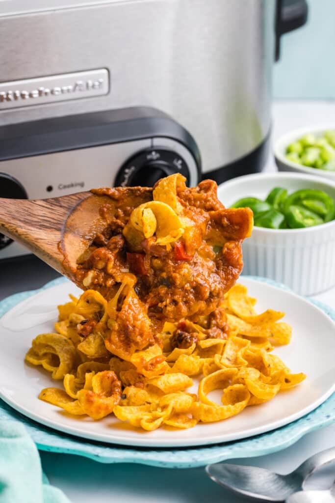 scoop of frito pie on frito chips.