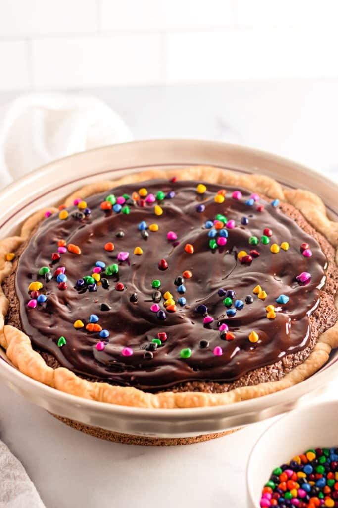 brownie pie topped with rainbow chips.