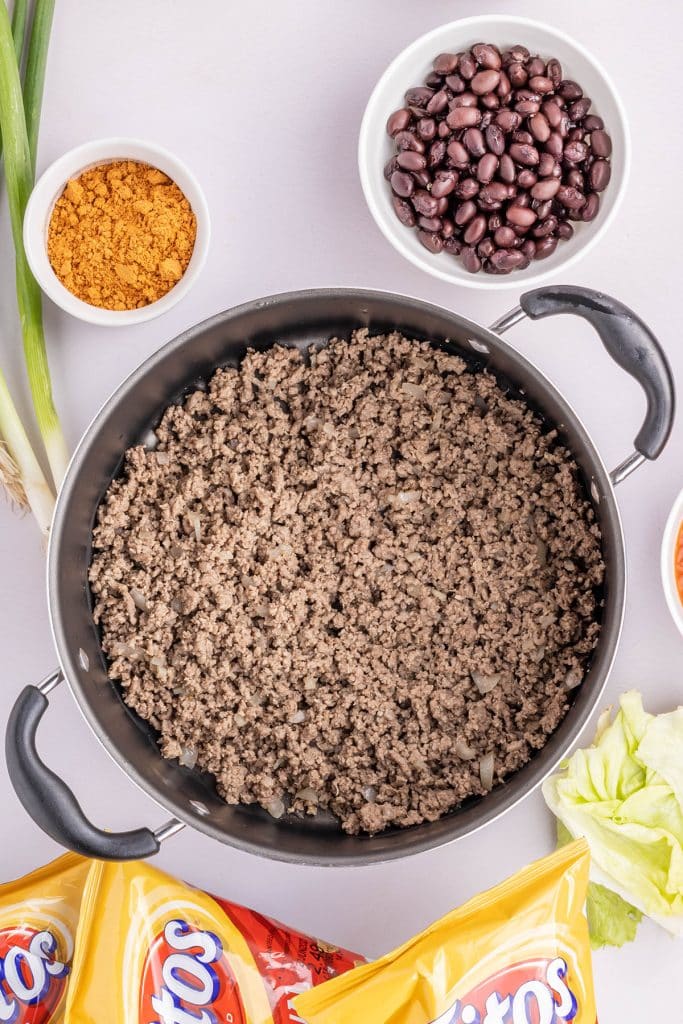 overhead shot of ground beef in a skilelt.