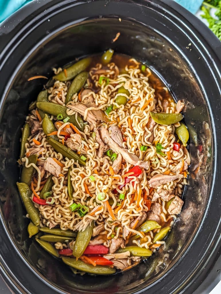 overhead shot of chicken ramen in a slow cooker.