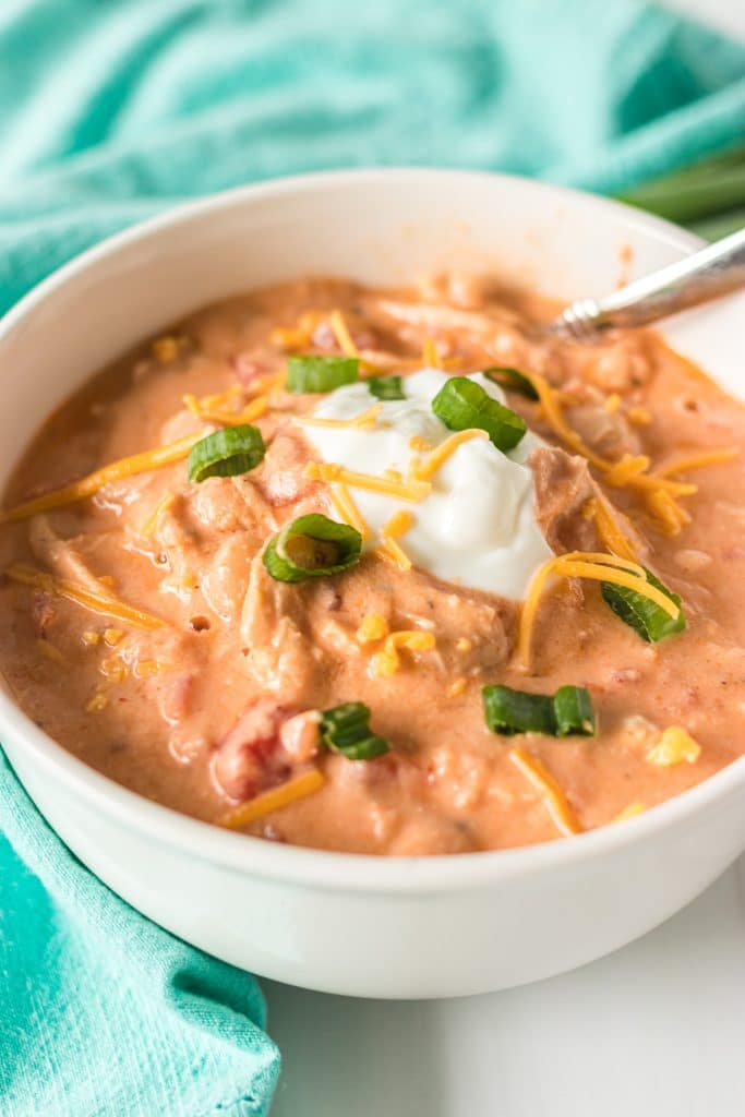 bowl of buffalo chicken chili with a spoon in it.