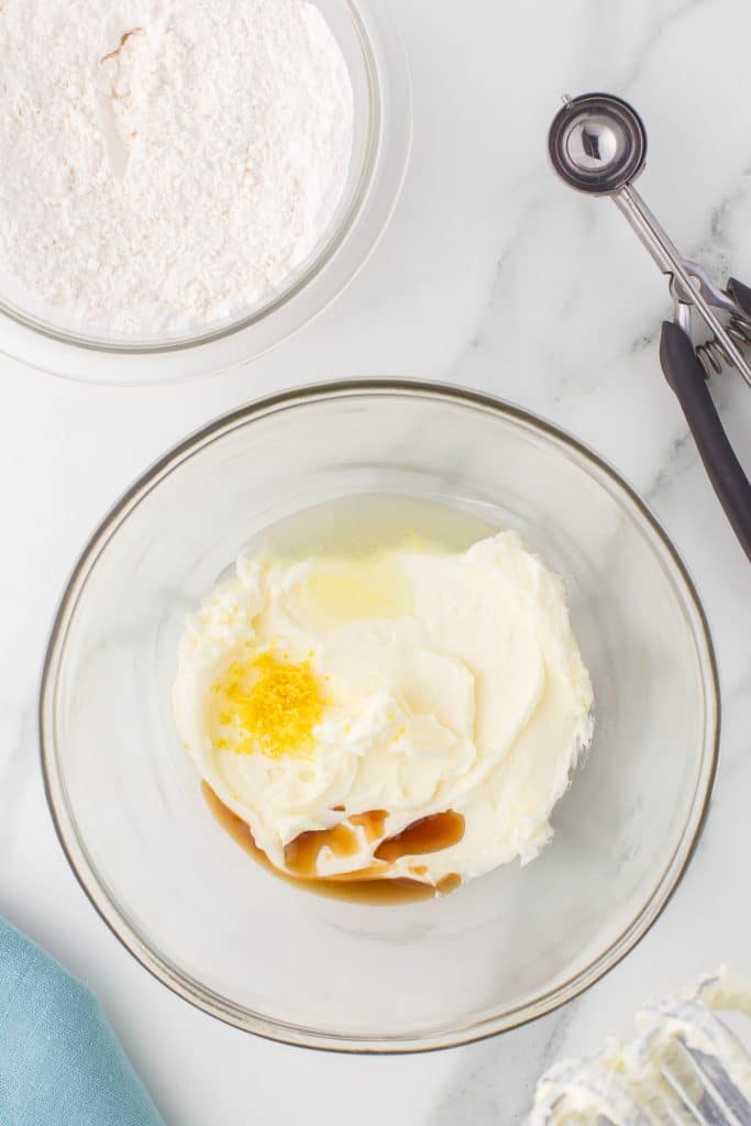 overhead shot of cookie dough in a glass mixing bowl.
