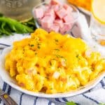 plate of mac and cheese with ham.