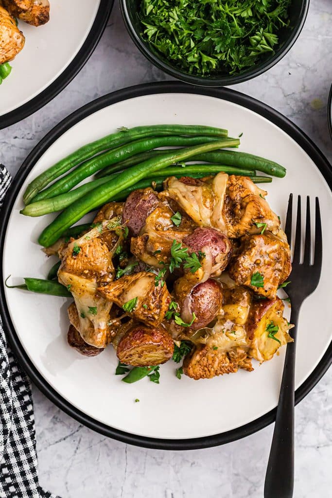 overhead shot of plate with chicken, potatoes, and green beans.