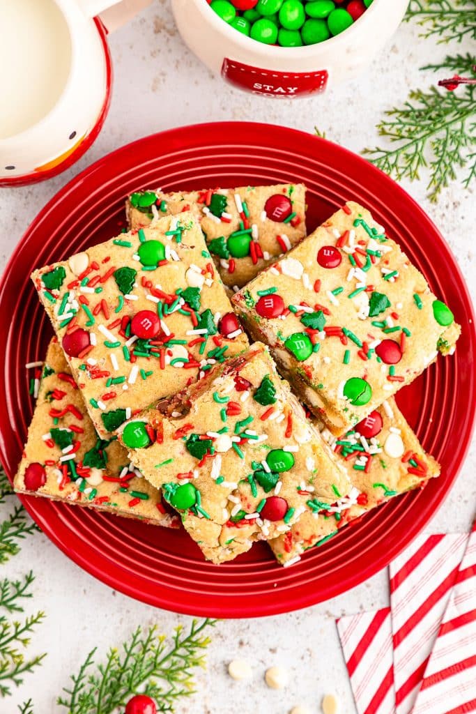 overhead shot of christmas cookie bars on a red plate.