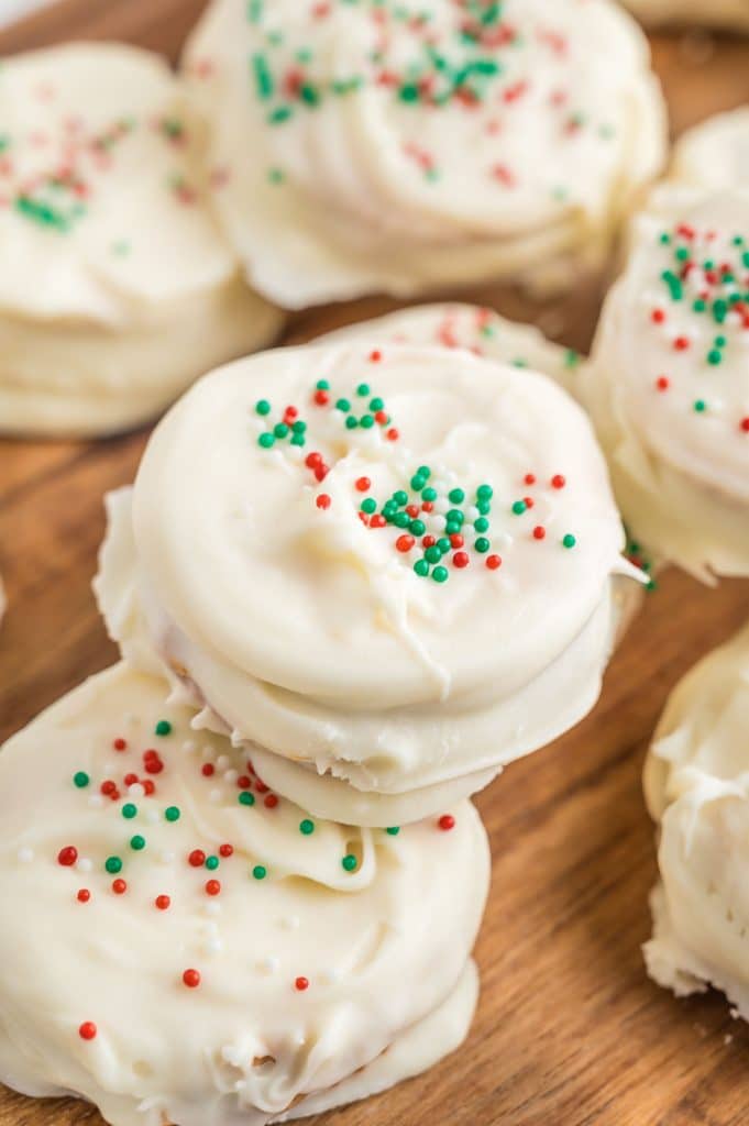 stack of ritz cracker cookies with christmas sprinkles.