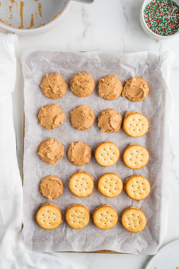 overhead shot of peanut butter filling in ritz cracker cookies.