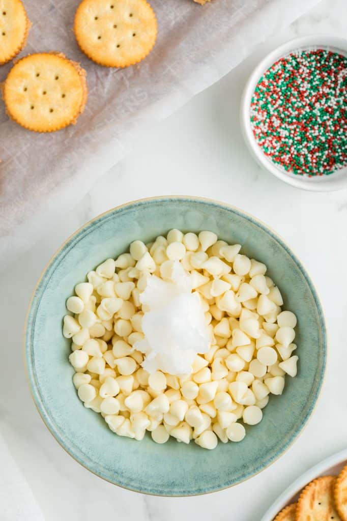mixing bowl with white chocolate chips & coconut oil.