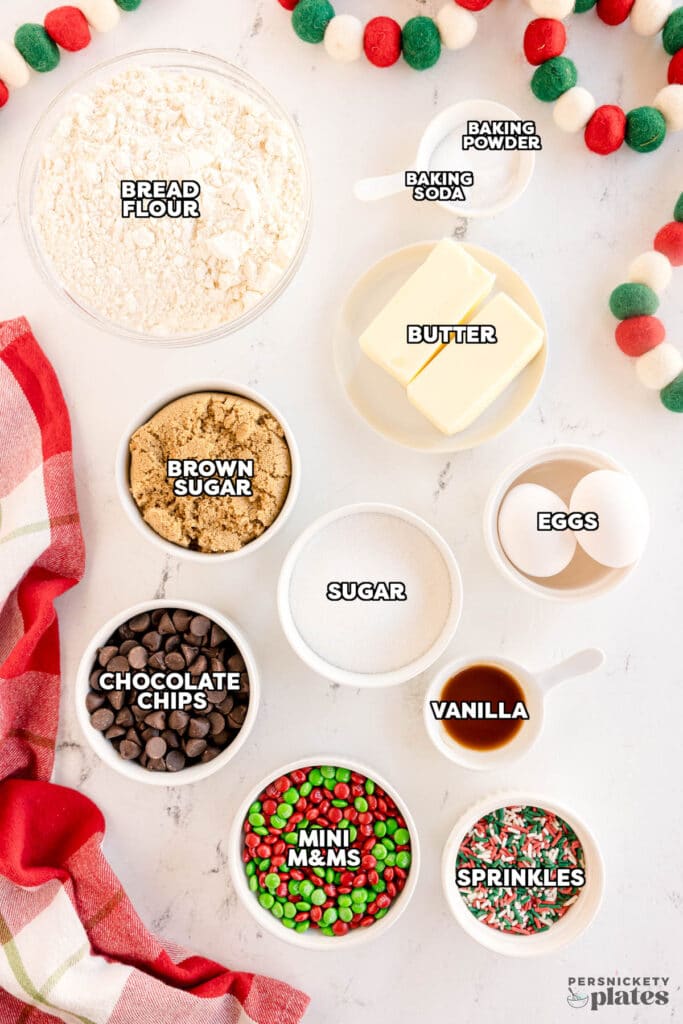 overhead shot of labeled ingredients laid out to make christmas cookie bars.