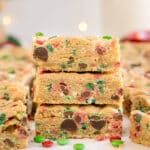 stack of christmas cookie bars with colorful M&Ms and sprinkles.