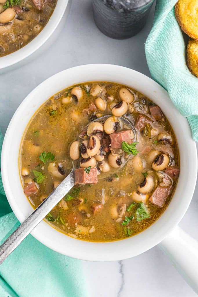spoon in a bowl of black eyed peas.