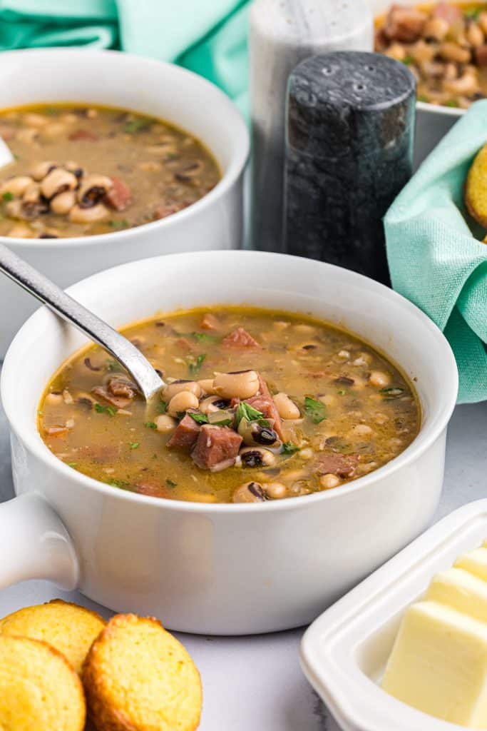 bowl of black eyed peas with cornbread.