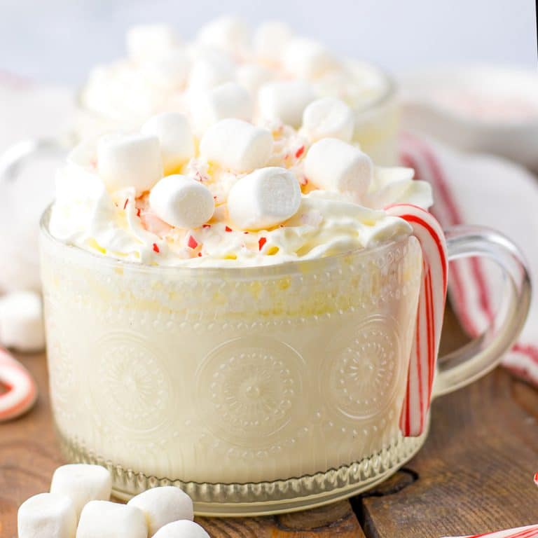 mug of peppermint white hot chocolate topped with marshmallows.