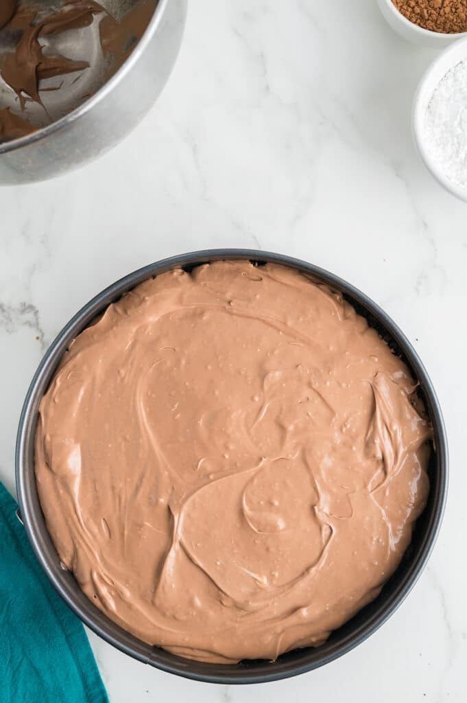 overhead shot of cheesecake batter in a pan.
