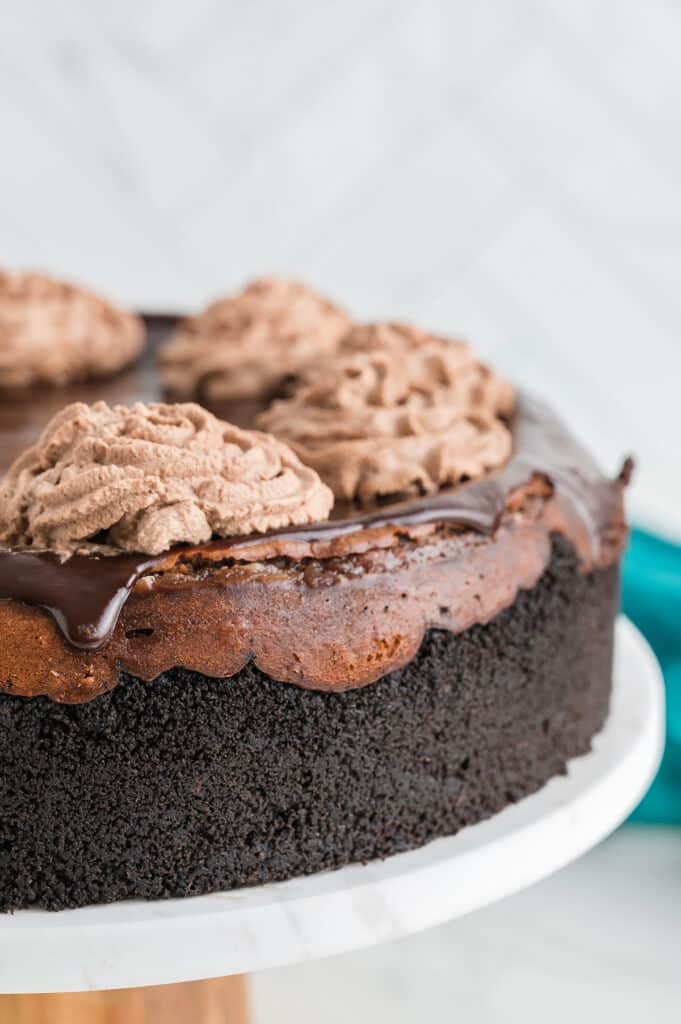 side view of a triple chocolate cheesecake.