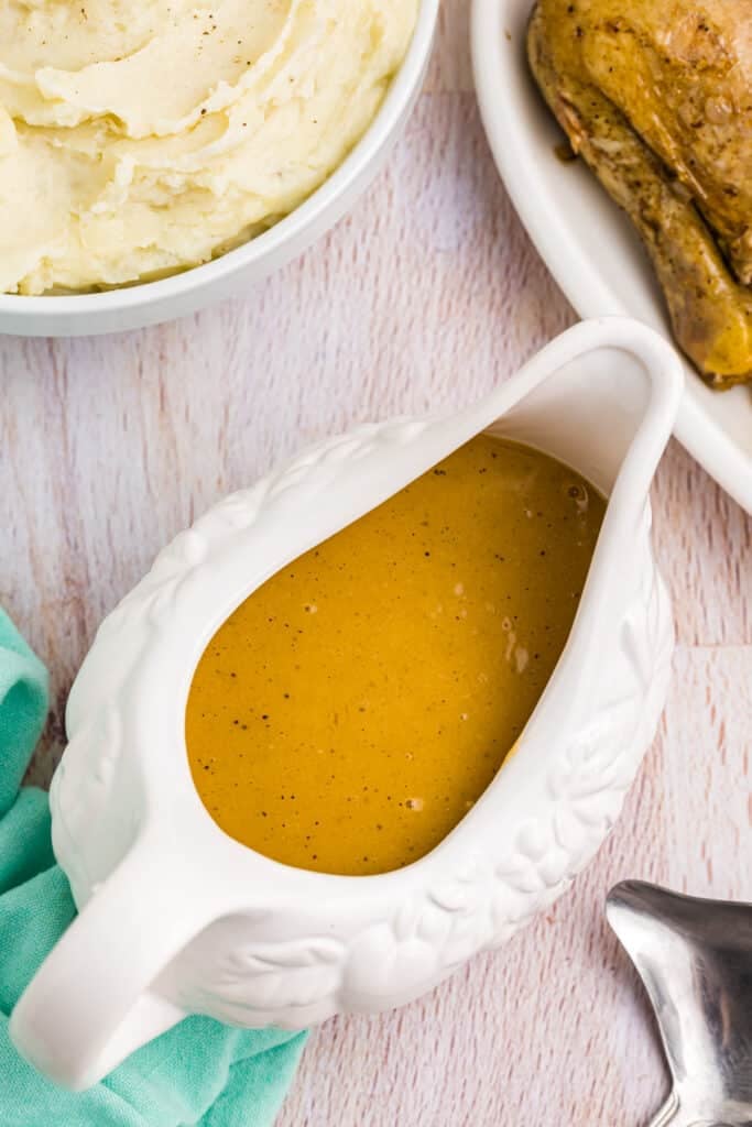 overhead shot of chicken gravy in a gravy boat.