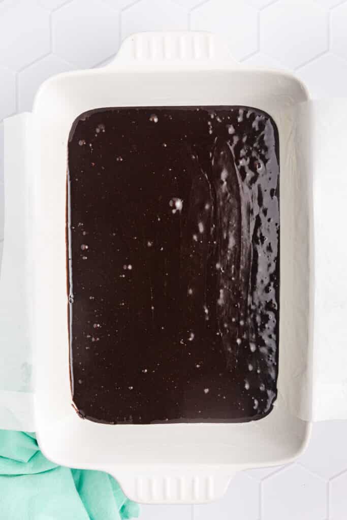 prepared brownie mix poured into a baking dish.