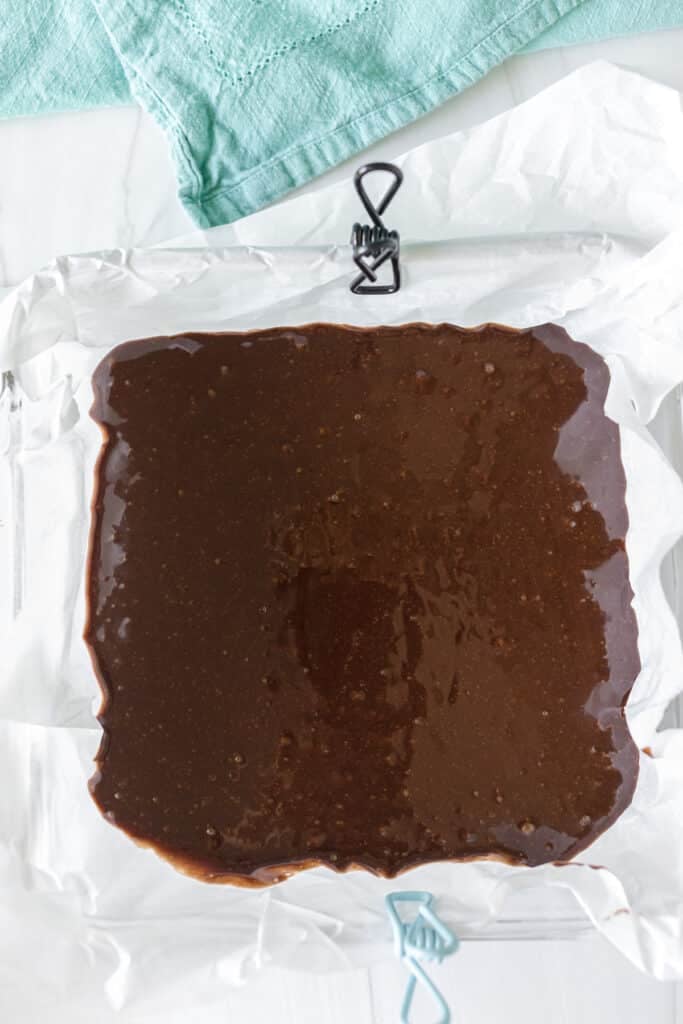 brownie batter in an 8x8 baking dish.