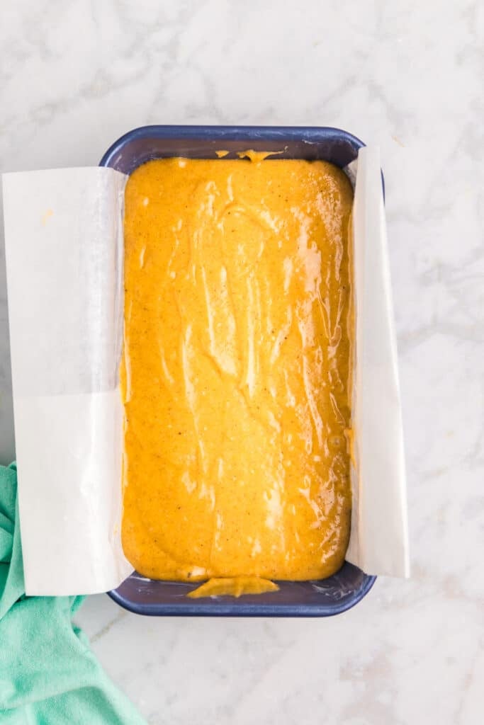 overhead shot of pumpkin bread batter in a loaf pan.