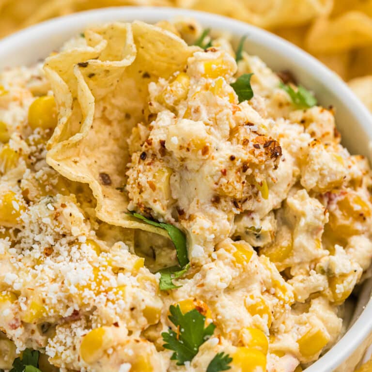 smoked corn dip with a tortilla chip.