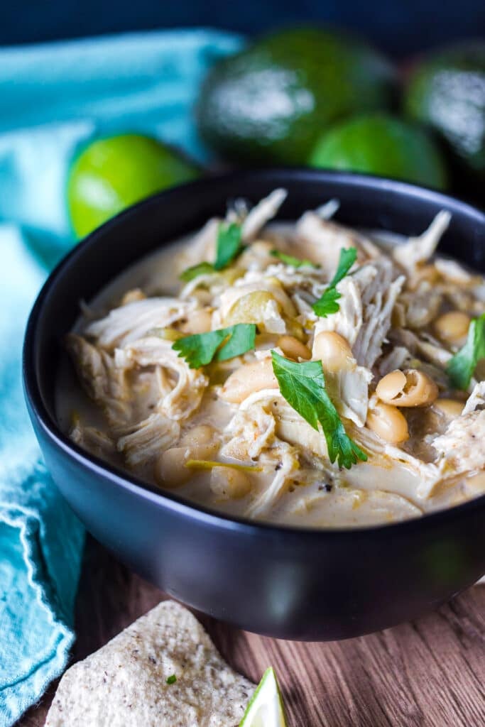 bowl of white bean chicken chili topped with cilantro.