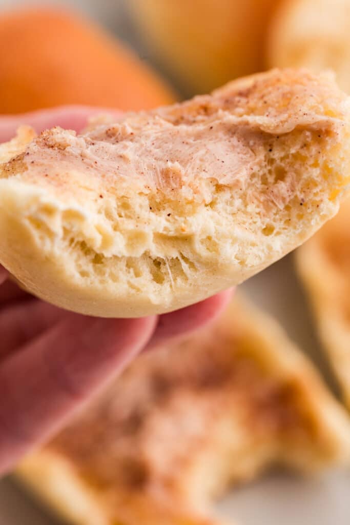 a texas roadhouse roll with a bite taken out of it.