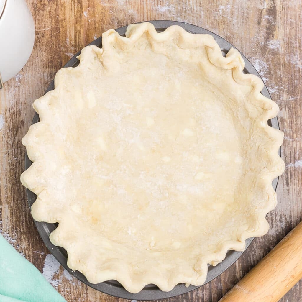 overhead shot of butter pie crust in a pie plate.