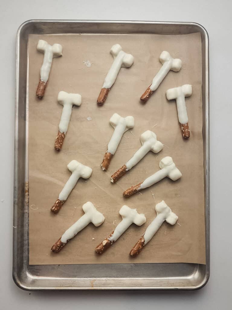 pretzel sticks dipped in white chocolate to look like bones.