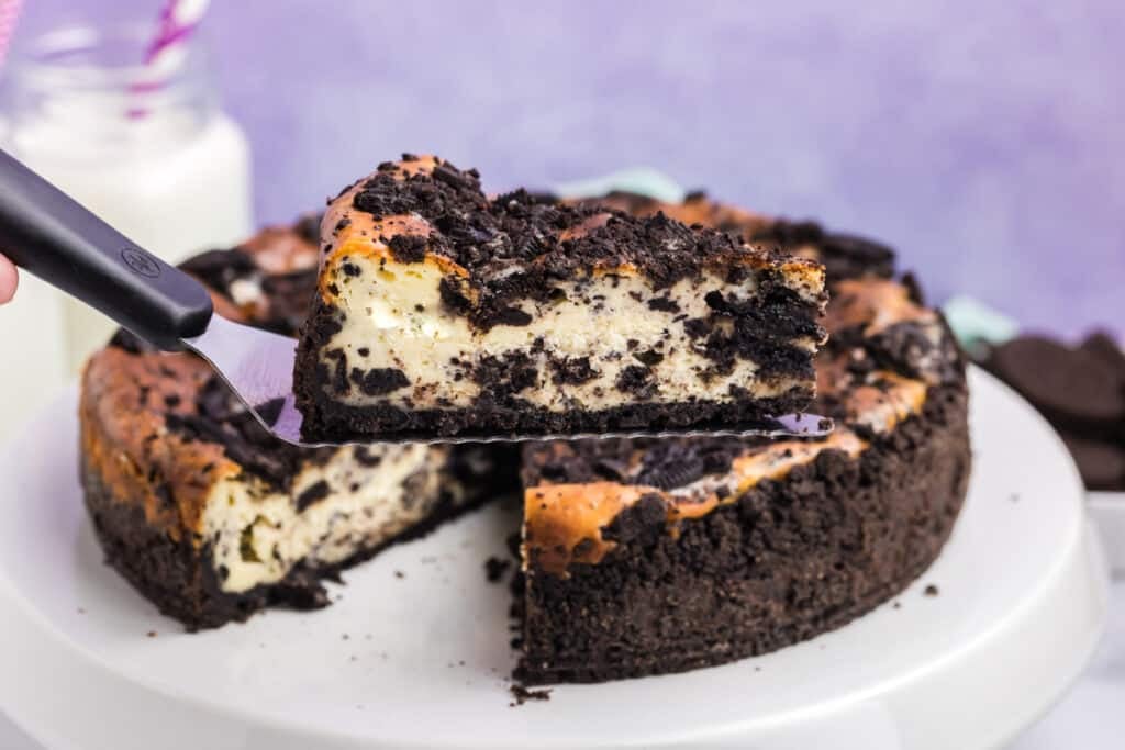 slice of oreo cheesecake being lifted from the cake.