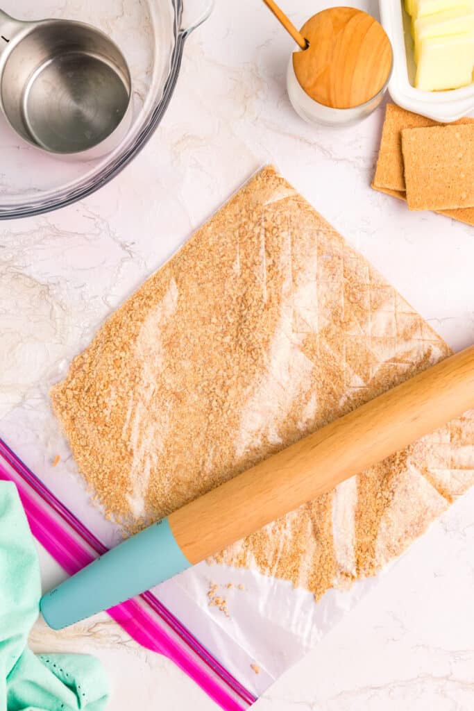 Crushed graham crackers crumbs in a plastic bag.