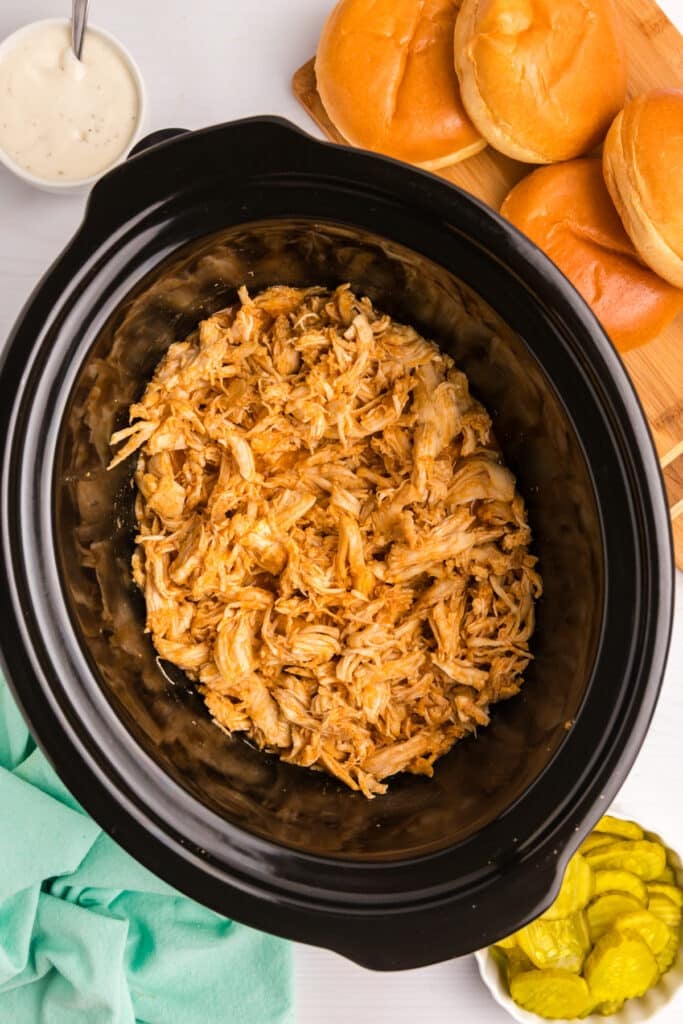 shredded nashville hot chicken in a slow cooker.