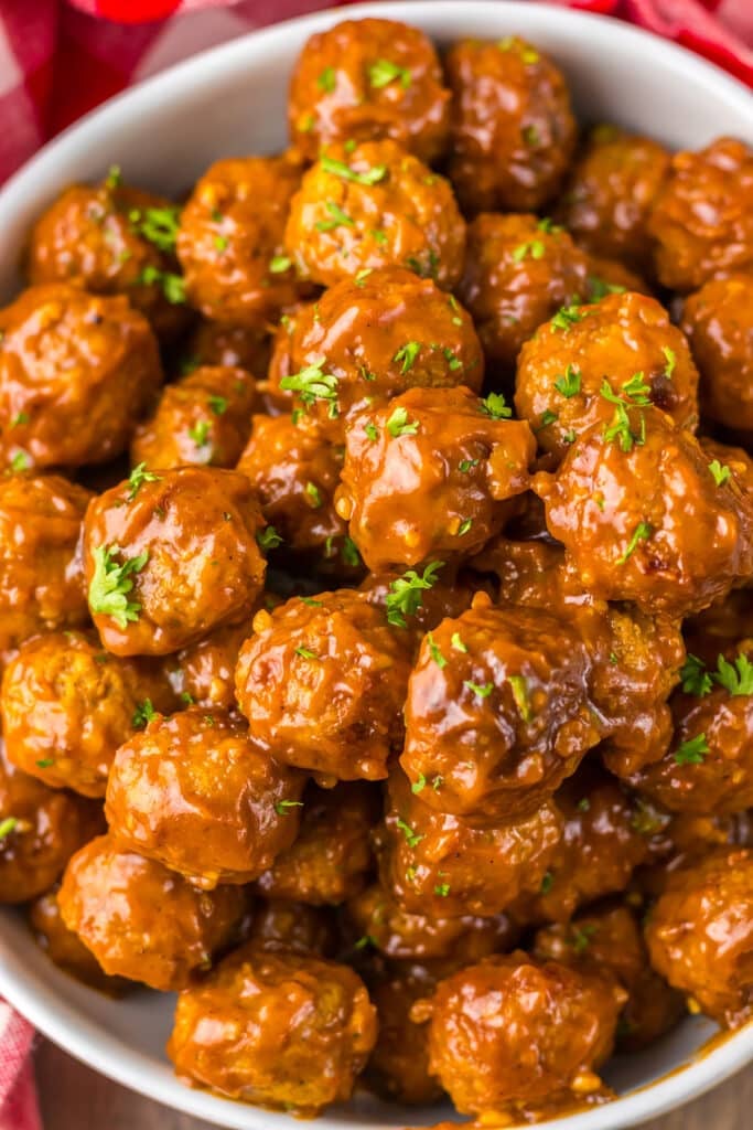 overhead shot of bowl of coca-cola meatballs.