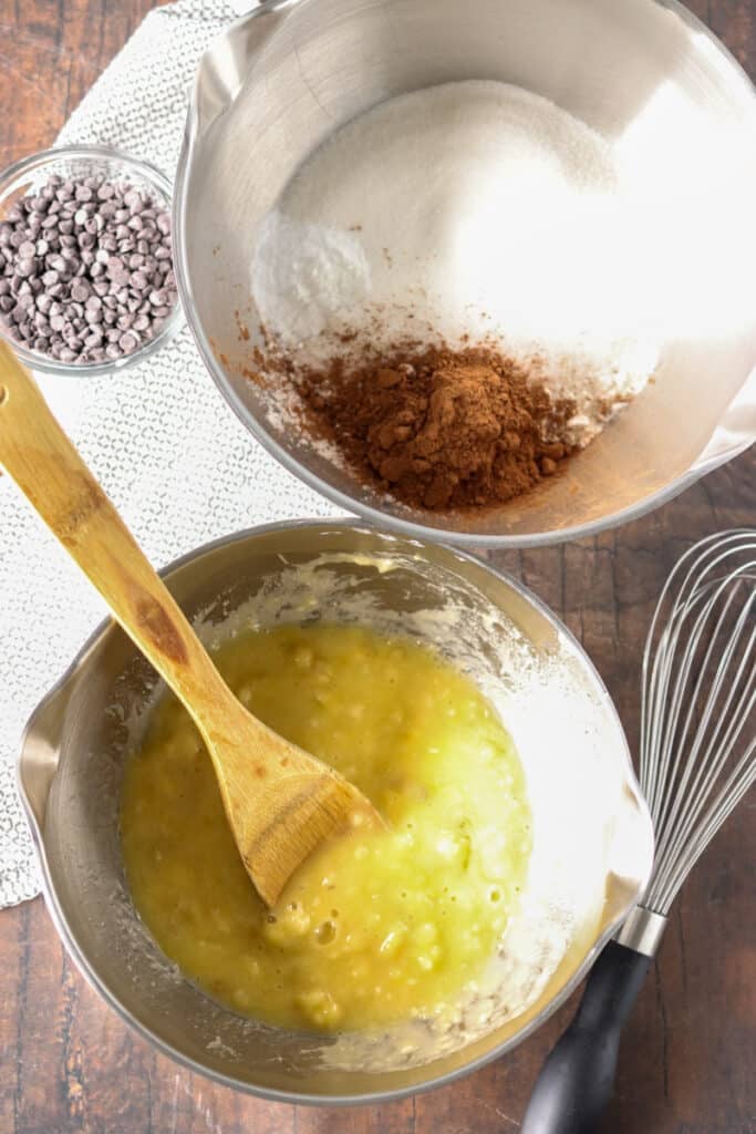 overhead shot of two mixing bowls - one with wet ingredients, one with dry.