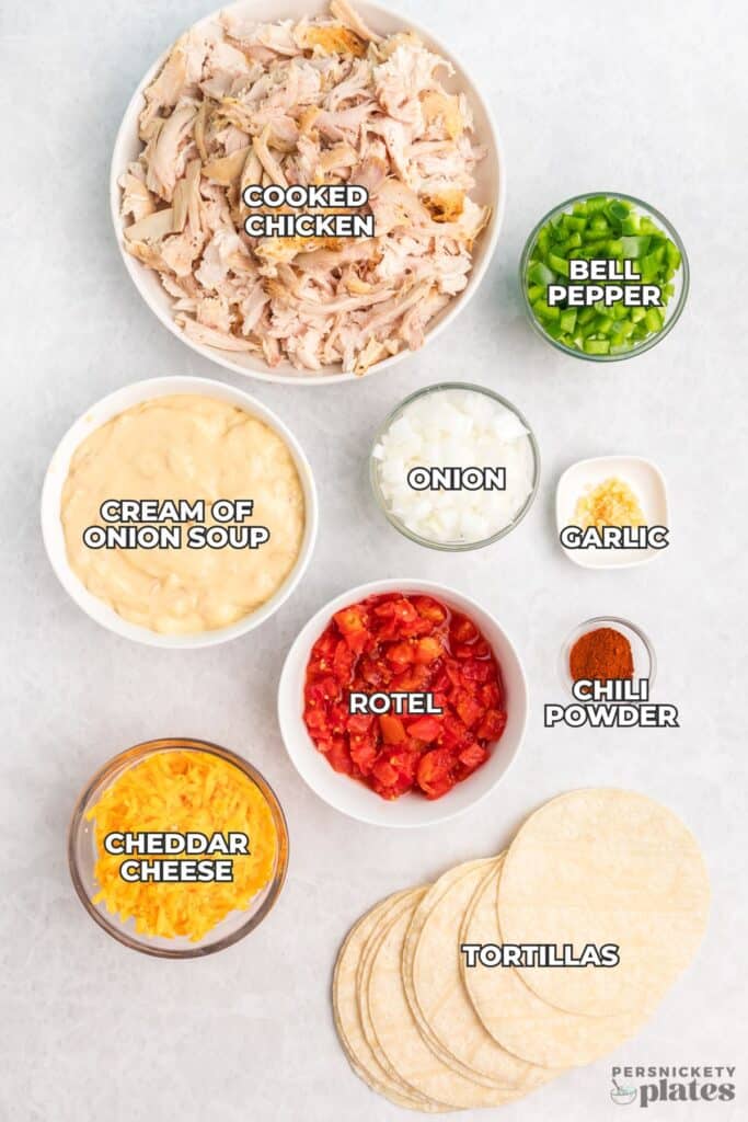 Overhead view of labeled King Ranch chicken ingredients arranged in bowls.