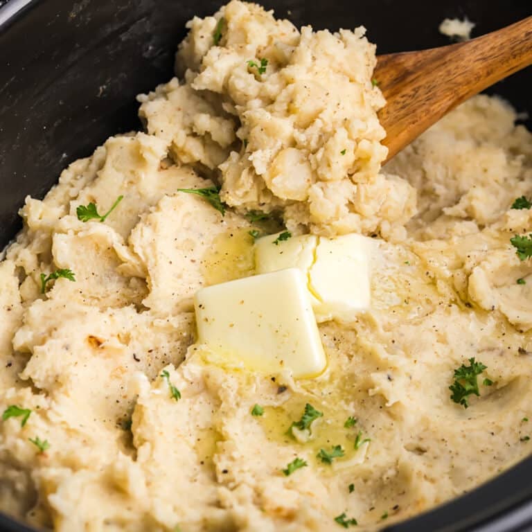 Mashed potatoes with melted butter and parsley.